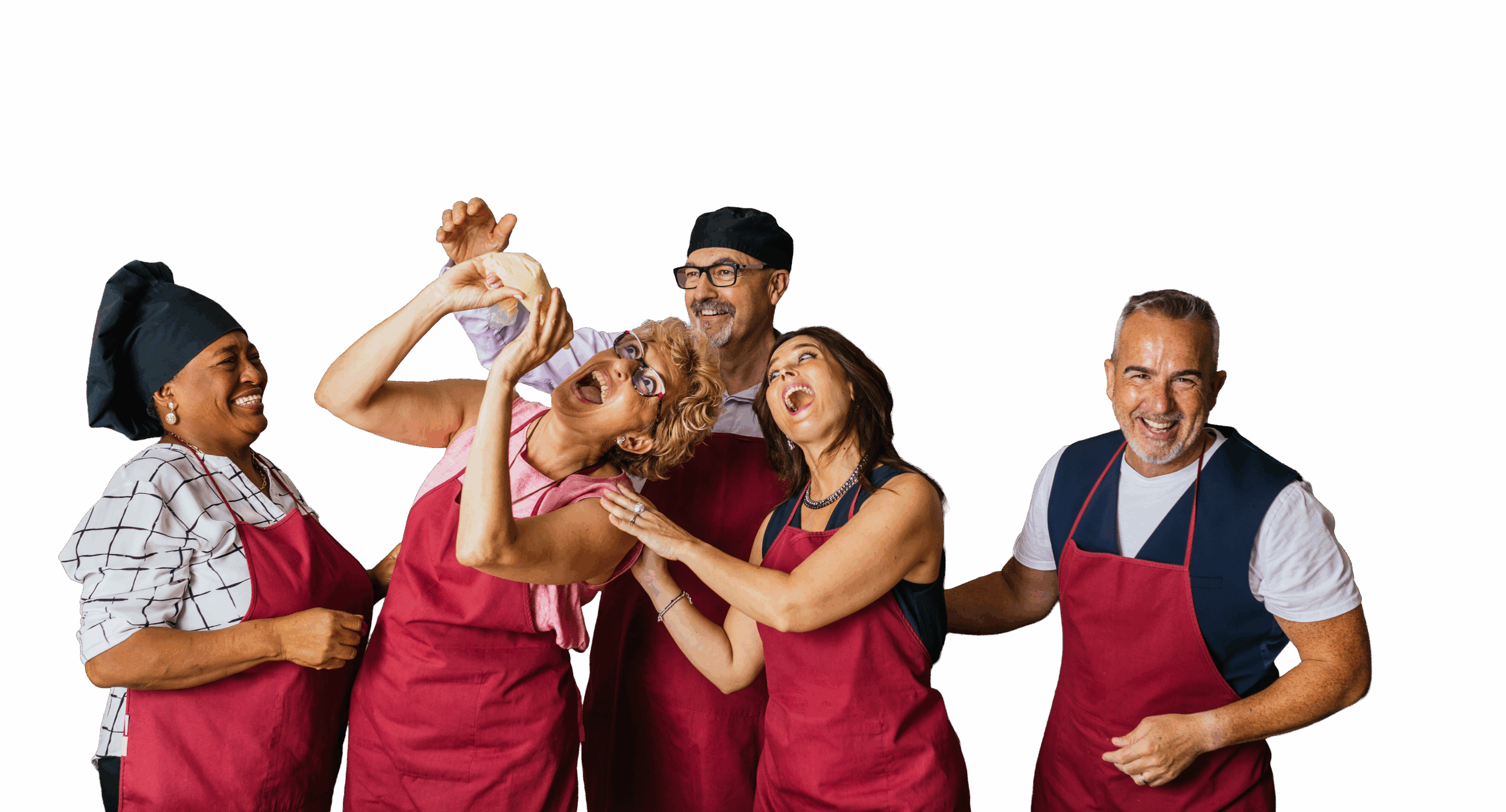 Un gruppo di persone in grembiule ride e cucina insieme durante una cooking class di team building.
